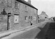 cottages-both-sides-of-coop-last-framed-knitting-cottage