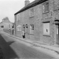 cottages-both-sides-of-coop-last-framed-knitting-cottage